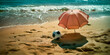 The concept of rest and sports. Parasol with a ball on a sunny beach.