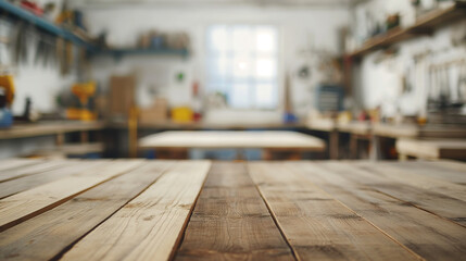 Rustic wooden table in a carpentry workshop with a blurred background of tools and equipment