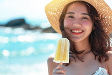 Young Smiling Kid Holding A Popsicle Smiling In Front Of The Sea