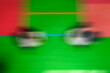 A bright background on the theme of martial arts with a wrestling hall blurred in motion, guessed by traditional colors.