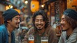 © MiguelAngel - Three Asian men share good times drinking beers at the bar table.