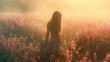 A woman stands amidst a vibrant wildflower meadow, bathed in the golden light of a tranquil sunset, evoking a sense of peace..