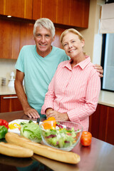 Sticker - Senior man, woman and happy in cheerful, smile and cooking in kitchen at home for dinner, plans and family. Mature couple in preparing, food or salad for healthy, eating and nutrition in house