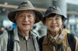 close-up of an Asian couple at the airport gates