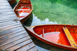 Traditional style wooden rowboats alongside in lake Croatia