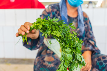 Wall Mural - Fresh parsley for sale at a market in Bukhara.