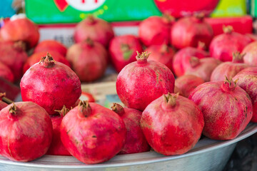 Wall Mural - Fresh pomegranites for sale at a market in Bukhara.