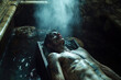 © alexkoral - sleeping dead man vampire lying in coffin in a dark frightening crypt in cemetery