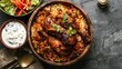 Restaurant style Spicy Chicken Biryani in wooden bowl with Raita and salan