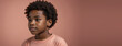 © Pixel Matrix - 10-12 Years African American Boy, Isolated On A Coral Background With Copy Space