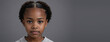 An African American Juvenile Girl, Isolated On A Grey Background With Copy Space