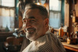 © Formoney - A man with a beard and gray hair is sitting in a barbershop