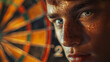 Young man with dartboard in background