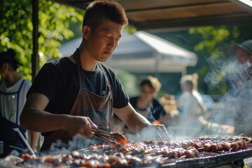 A man busy at the barbecue.