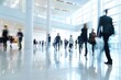 © Anna - Bright business workplace with people in walking in blured motion in modern office space
