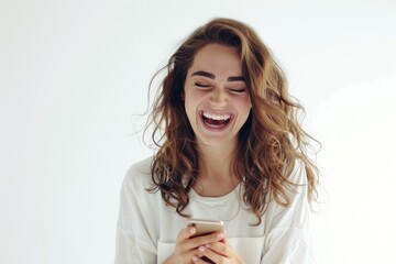 Funny woman looking at a smartphone screen and laughing Isolated on white background