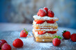 French dessert Mille Feuille with custard cream and strawberries on ceramic plate, powdered with sugar
