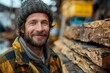 Close-up of a cheerful rugged man with logs and chains in the background