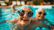 Dos señoras felices riendo y disfrutando de la piscina en un viaje de turismo en verano dentro del agua con gafas y mucho sol y colores.