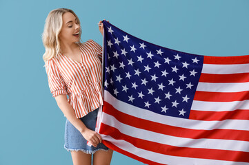 Canvas Print - Young woman with USA flag on blue background