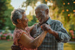 african american senior couple dancing looking on each other with love