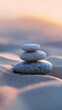A stack of rocks balancing precariously on top of a sandy beach, smooth sand, showcasing natures delicate balance