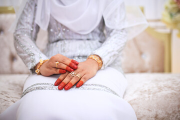 Wall Mural - Close-up of wedding details. The bride's wedding ring on the finger. Malay Wedding day.