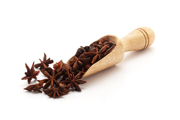 Wall Mural - Front view of a wooden scoop filled with Organic Star anise or Chakra Phool (Illicium verum). Isolated on a white background.