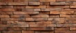 Close up view of a sturdy wall constructed with blocks made of wood, presenting a rustic and natural appearance