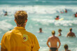 A lifeguard observing swimmers in the ocean, embodying beach safety and vigilance