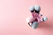Top view of pink cosmetic brushes on pastel background, professional tools for make up