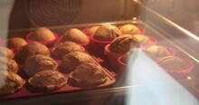 Muffins In Their Molds Baking In The Oven