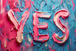 Vibrantly colored 'YES' inscription