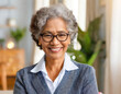 © OceanProd - portrait of senior old grey hair woman wearing glasses interior home american african origin smiling with happiness