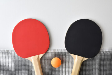 Wall Mural - Set of table tennis paddles net and ball on white