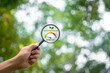 Magnifying glass measures net zero emissions with green area search for fresh air carbon neutral, environmentally friendly energy saving Long-term climate-neutral strategy Renewable energy.