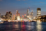 Fototapeta  - Panoramic view of London's skyline and thames river aglow with city lights at dusk
