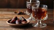 featuring traditional Turkish Arabic tea glasses placed alongside dried dates and spoons, on a rustic wooden table