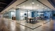 A glass wall and partition divide an office space into sections