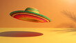 © praewpailyn - A colorful sombrero floats mid-air, casting a vibrant shadow on a sun-drenched, warm orange background