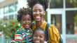 © Keitma - Mother and two children family in front of an elementary school on back to school day