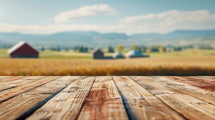 Wall Mural - A wooden table is pictured in the foreground, with a farm visible in the background