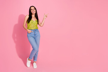 Sticker - Photo of adorable pretty nice girl wear trendy clothes introduce empty space isolated on pink color background