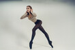 young ballerina demonstrates choreography on pointe shoes