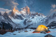 © ADDICTIVE STOCK - Moonlit snowy mountain landscape with glowing tent. Generative AI image