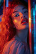 Young white woman with neon lights, dramatic makeup, intense gaze.