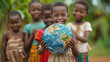 Joyful African girl holding globe, surrounded by friends, hopeful future.