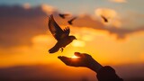 Fototapeta Przestrzenne - A hand holding a bird in the sky