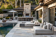 A chic outdoor living space with plush sofas and loungers by a glistening pool.