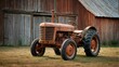 © sitifatimah - Vintage tractor in front of a barn